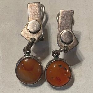 Handcrafted sterling silver earrings with pale amber cabochon at bottom